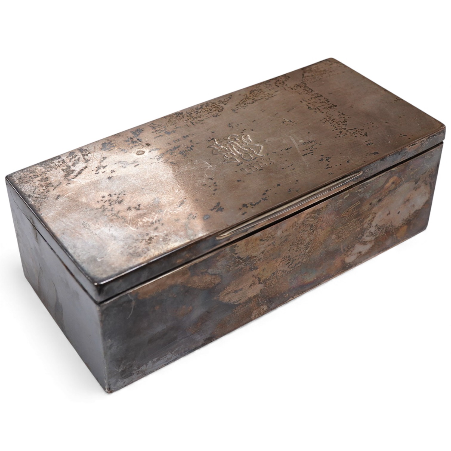 A Victorian silver rectangular cigarette box, by George Unite, with two interior lidded cedar wood lined compartments and engraved WS monogram, London, 1885, 17.9cm. Provenance - formerly the property of Walter Shoolbred